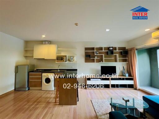 Photo of a modern apartment living space with integrated kitchen area