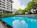 Outdoor swimming pool with adjacent building