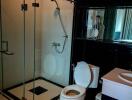 Modern bathroom with glass shower enclosure and white fixtures