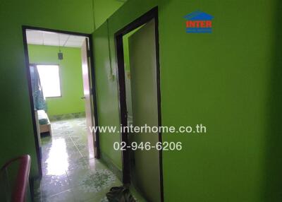 Green bedroom with tiled floor