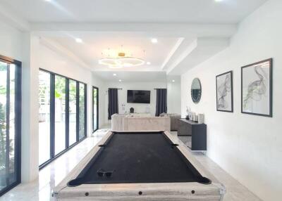 Stylish recreation room with pool table and modern decor
