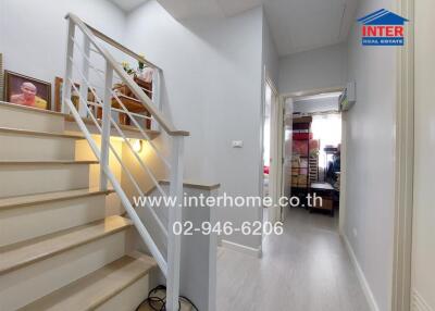 Staircase and hallway with interior decor