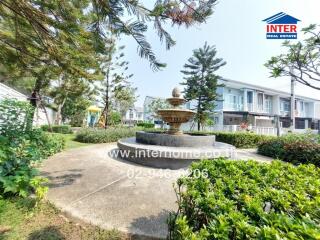 Beautiful garden with a fountain in a residential area