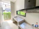 Modern kitchen with granite countertops and large windows