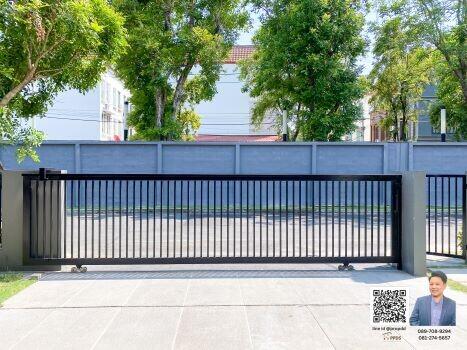 Gated entry with trees in the background