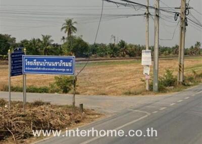 Land plot in rural area with road and signage