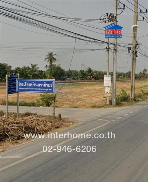 Land plot in rural area with road and signage
