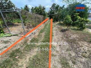 Outdoor area with fence and pathway