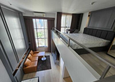 Modern loft with large windows and mezzanine bedroom