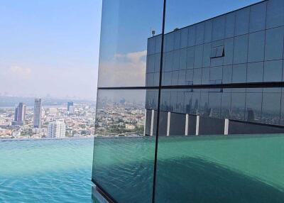 Modern high-rise building with infinity pool