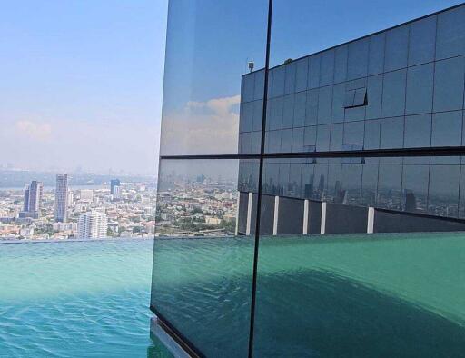 Modern high-rise building with infinity pool