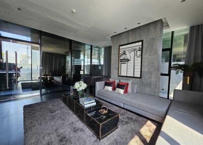Modern living room with glass wall and sectional sofa