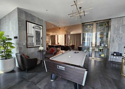 Recreational room with pool table and seating area