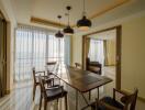 Modern dining area with wooden table and chairs