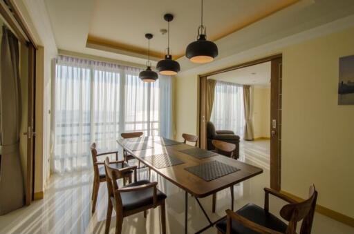 Modern dining area with wooden table and chairs