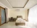 Modern bedroom with large windows and natural light