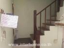 Indoor staircase with wooden railing