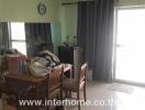 Dining area with table, chairs, and window