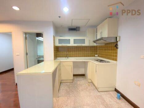 Kitchen with white cabinets and yellow backsplash