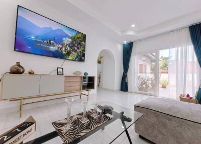 Modern living room with large window and TV