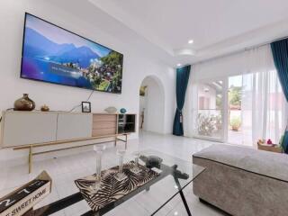 Modern living room with large window and TV