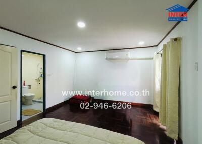Bedroom with bathroom and air conditioning