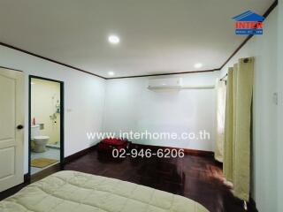 Bedroom with bathroom and air conditioning
