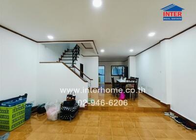 Spacious living room with staircase