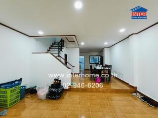 Spacious living room with staircase