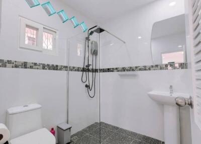 Modern bathroom with shower and tile flooring