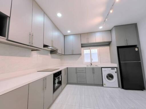 Modern kitchen with built-in appliances and ample storage