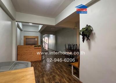 View of a living area with wooden flooring and furniture