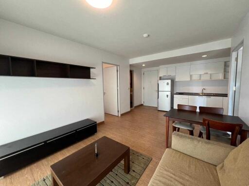 Living area with a view of the kitchen