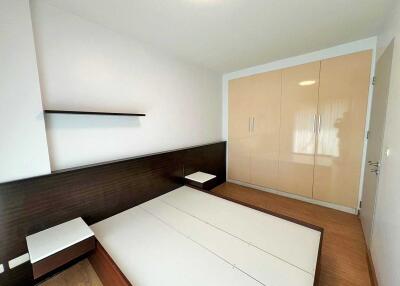 Spacious bedroom with built-in wardrobes and a modern design.