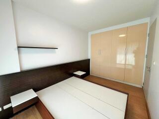 Spacious bedroom with built-in wardrobes and a modern design.