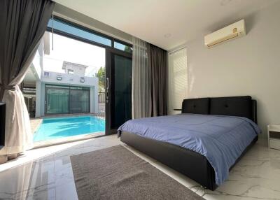 Modern bedroom with pool view