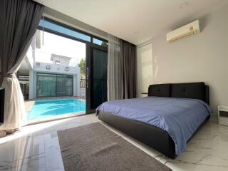 Modern bedroom with pool view