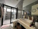 Modern bathroom with large mirror and glass shower enclosure