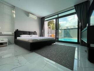 Spacious bedroom with pool view