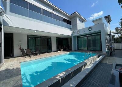 Modern house with swimming pool and patio area