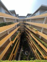 Multi-story apartment building with interior courtyard