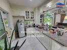 Modern kitchen with white cabinetry and appliances