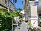 Outdoor area with greenery and laundry drying