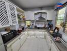 Modern kitchen with white cabinets and stainless steel appliances