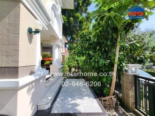 Exterior view of a house with a porch and garden area