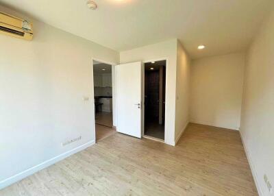 Bright empty living room with wooden flooring