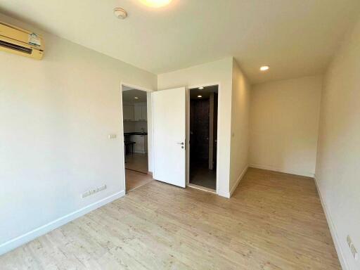 Bright empty living room with wooden flooring