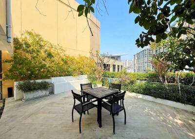 Modern outdoor patio with chairs and table