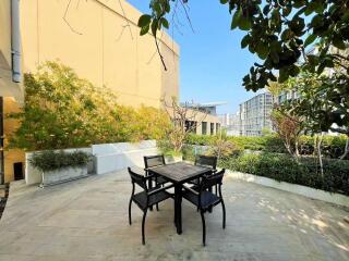 Modern outdoor patio with chairs and table