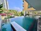 Outdoor pool area with a view of surrounding buildings